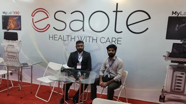 Talha and a colleague at the Esaote stand